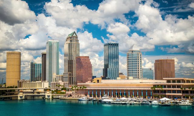 Tampa Florida skyline with sun and clouds